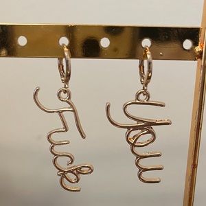 “Fuck You” dangling earrings